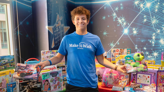Michigan kid Jude is standing in front of the presents for his wish to give