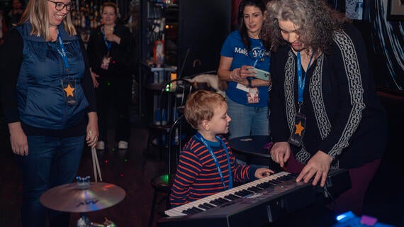 Nolan rocking out on the keys during his wish celebration.
