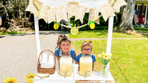 Kids selling lemonade to raise funds for wishes