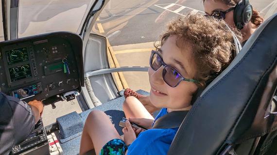Rhydian in the front seat of the  Blue Hawaiian helicopter before take-off. 