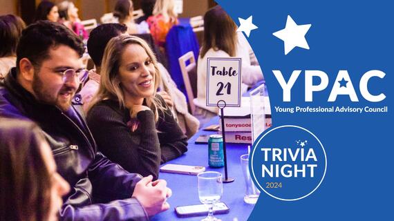YPAC Trivia Night Promotional Banner with a photo of two individuals playing trivia at their table with a sign reading 21