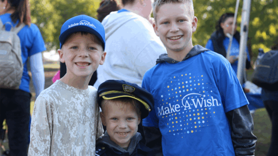 Three children standing together at Walk For Wishes