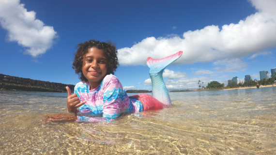 Wish kid on beach