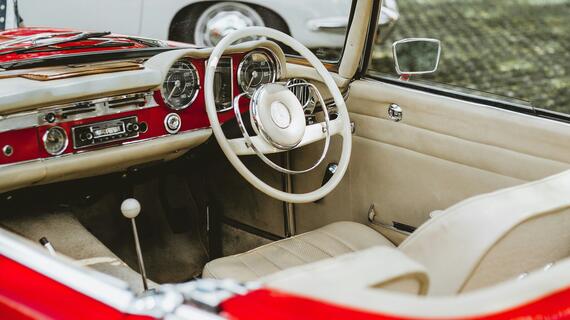 Classic red car interior in the daylight