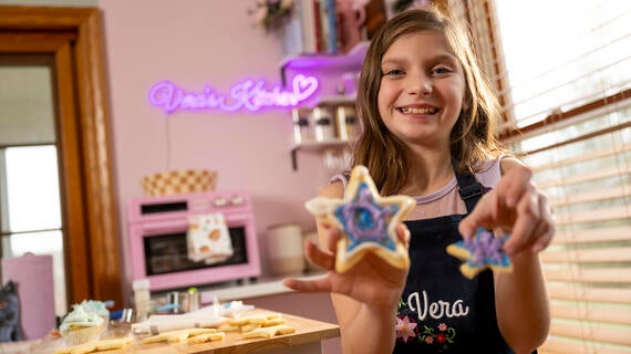 Wish kid Vera baking cookies