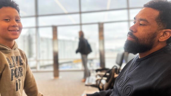 Wish kid Levi and dad in airport