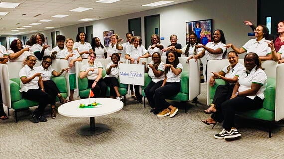 The Detroit Women's Golf Collective in the Make-A-Wish Michigan's Southfield Office