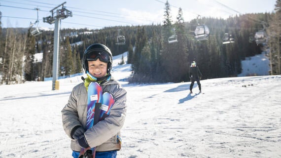 Wish kid Levi on the mountain for his skiing wish