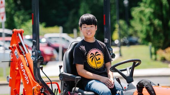 Photo of boy on a tractor
