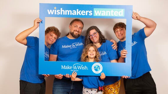 Opal and her family on white background wearing blue MAW tees 