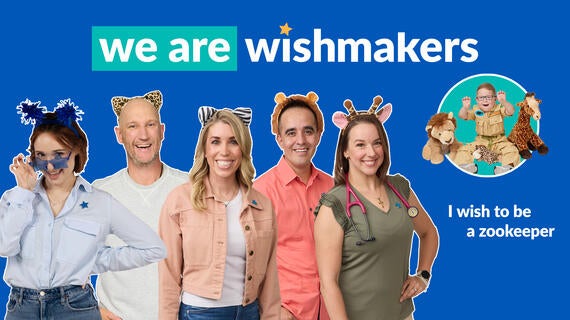 A group of adults wearing animal ear headbands and a child in a zookeeper costume sit amongst stuffed animals, under text that reads "we are wishmakers" and "I wish to be a zookeeper."