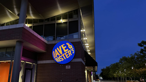 Dave & Busters sign on the outside of the building at night