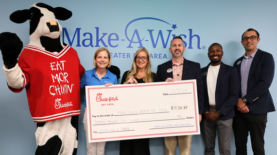 Chik-fil-A mascot and staff with Make-A-Wish staff  
