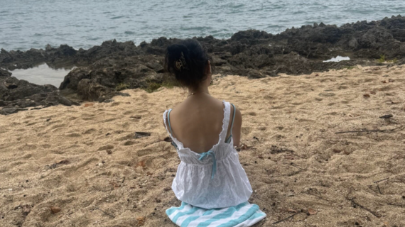 Samantha at the beach on her wish to go to Hawaii.