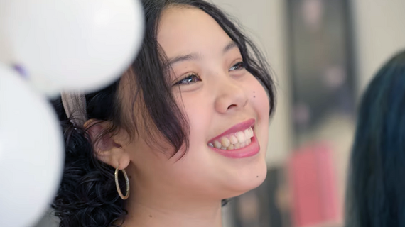 Wish kid Zoey smiles at her wish reveal