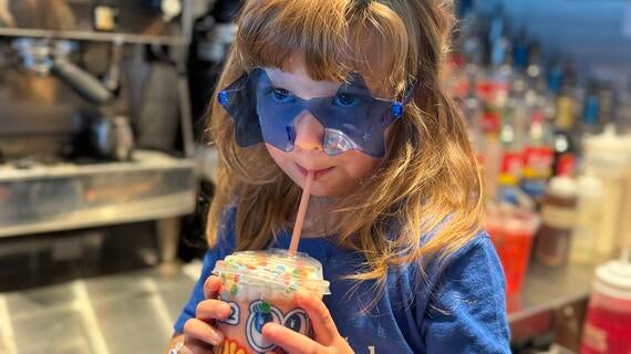 Wish Kid Abigail drinking Dutch Bros