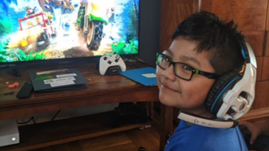 Wish Kid Daniel playing Xbox