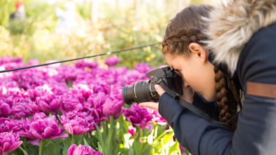 Wish kid Neeley photographing tulips in Amsterdam