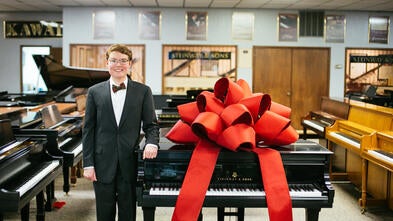 Andrew giving a new piano