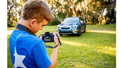 Colton photographing a Subaru Forester