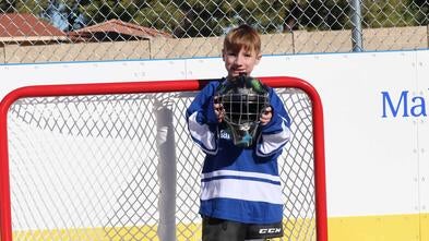 Max is ready to play on his backyard hockey rink wish