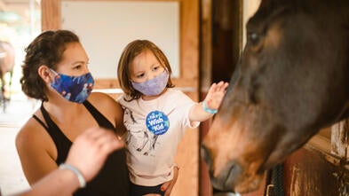 Sarah patting horse