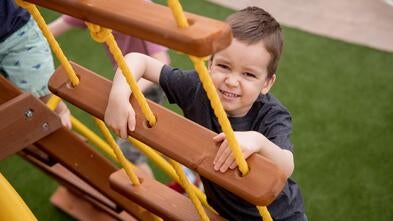 Teljn plays on his playset every day.
