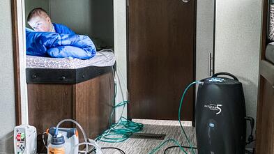 AJ with medical equipment