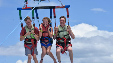 Grace parasailing with family