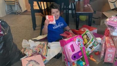 Penelope opens up her gifts from her online shopping spree wish.