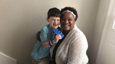 Volunteer Sophia hugging Wish Kid