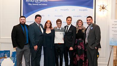 Travis Flores with family at Wish Gala