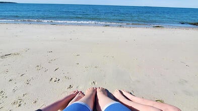 Wish Kid Skyla and family's toes in the samnd