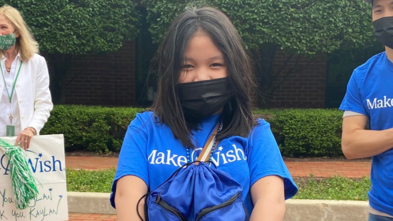 Kaylan holds one of the gift bags for homeless children
