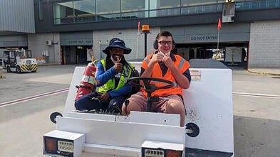 Wish Kid Cole with Jet Blue Employee