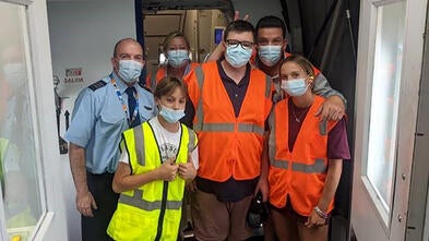 Wish Kid Cole on Plane with Jet Blue Crew