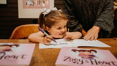 Zoey signing book