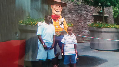 Tyler and brother with Woody at Disney
