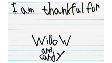 Eleanor's handwritten message on lined paper saying, "I am thankful for Willow and candy."
