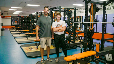 Scott in new weight room with his coach 
