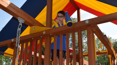 Laith enjoys his play set