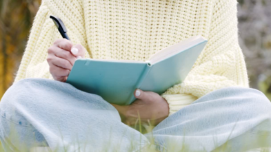 Girl writing in journal