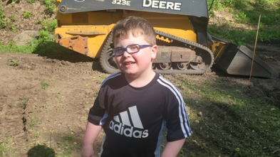 Greyson in his backyard 