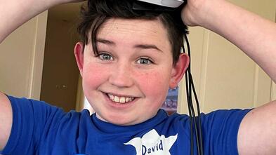 David holding VR above head