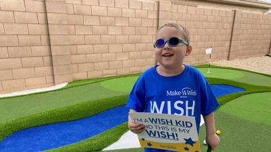 Wish kid Andrew was surprised with his wish to have a golf course