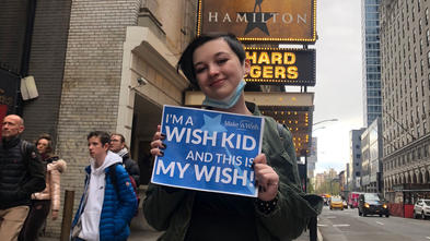 Madilynn outside of a Broadway theater on her wish day. 