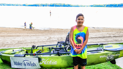 Nico in front of his kayak 