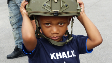 Wish child Khalil with police helmut