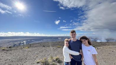 Wish kid Harrison with his siblings on the top of a volcano