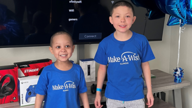 Kyree and his big brother smile on Kyree's wish day